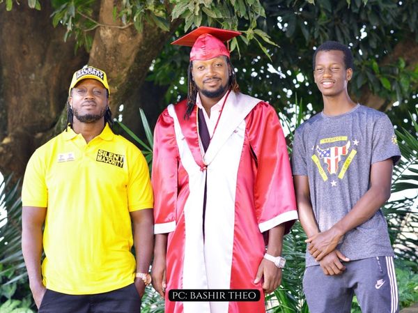Paper Daddy (M) with his dad, Bebe Cool (L) and his brother, Alpha Thierry Ssali (R)