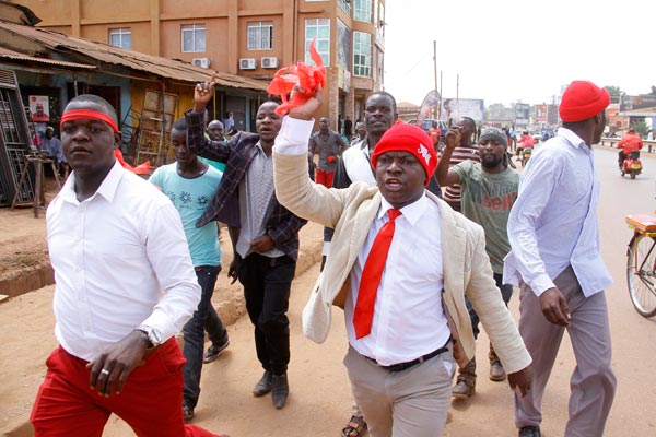 Ssegirinya (R) protesting during age Limit removal