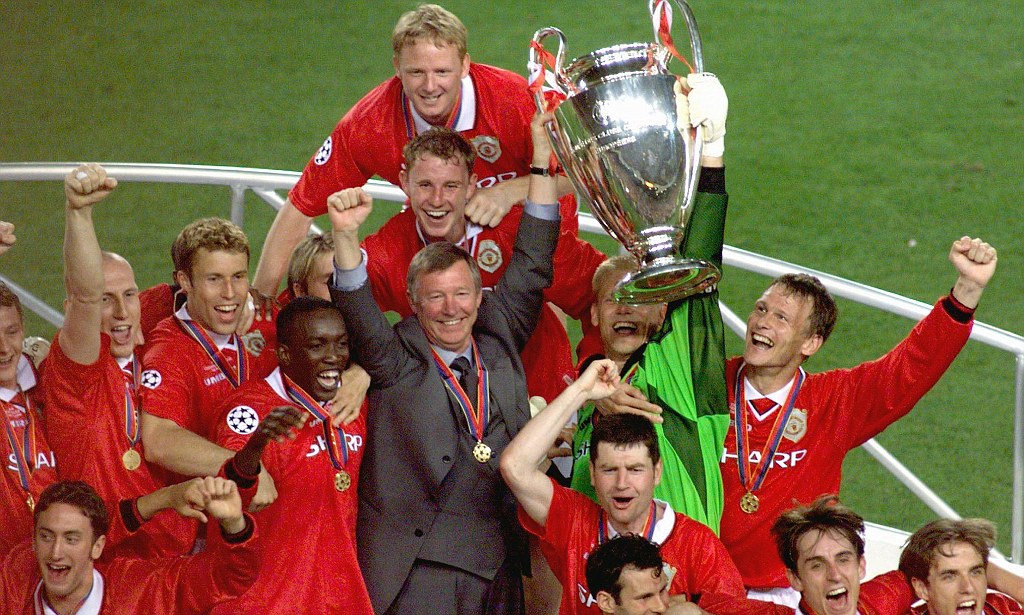 Sir Alex Ferguson celebrates with his players, after they defeated Bayern Munich in the Champions League