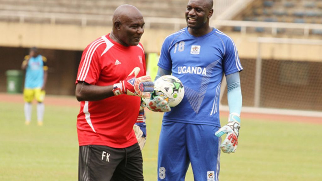 Fred Kajoba with former Cranes goalkeeper, Denis Onyango in training