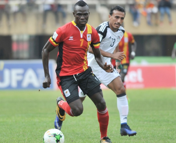 Abouzeid Mohamed of Egypt challenges Emmanuel Arnold Okwi of Uganda during the 2018 Fifa World Cup Qualifiers Russia on 31 August 2017 at Mandela Stadium, Namboole, Kampala.