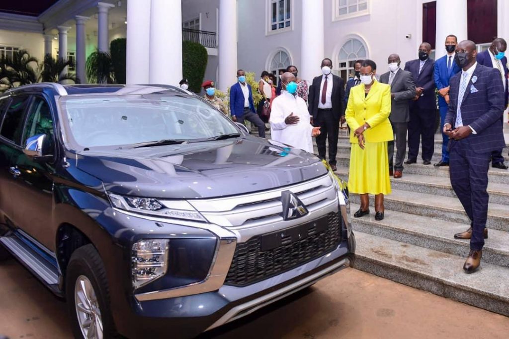 Museveni and wife, Janet handing over car to Onyango