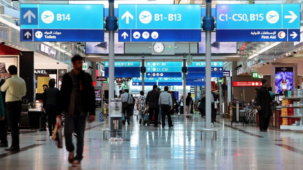 Passengers wait in transit at Dubai airport