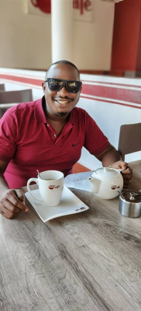 Solomon Serwanjja chilling at his cafe