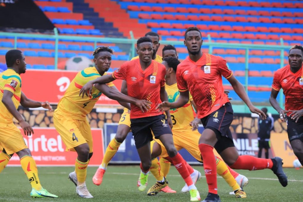 Murushid Juuko and Derrick Nsibambi defending against Mali