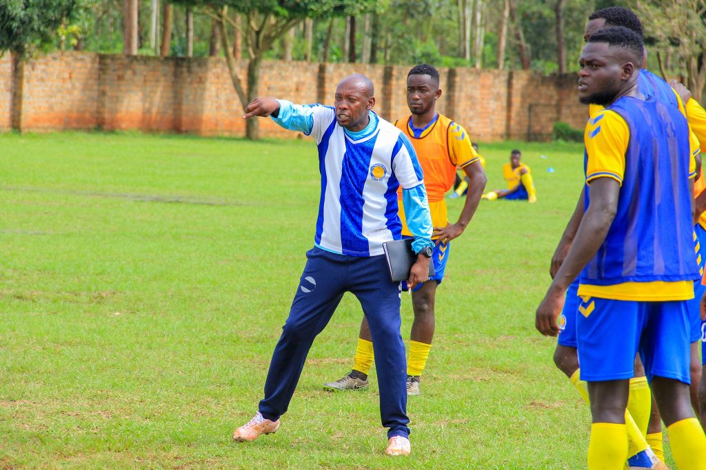 Simeon Masaba (in Sweat pants) is the head coach