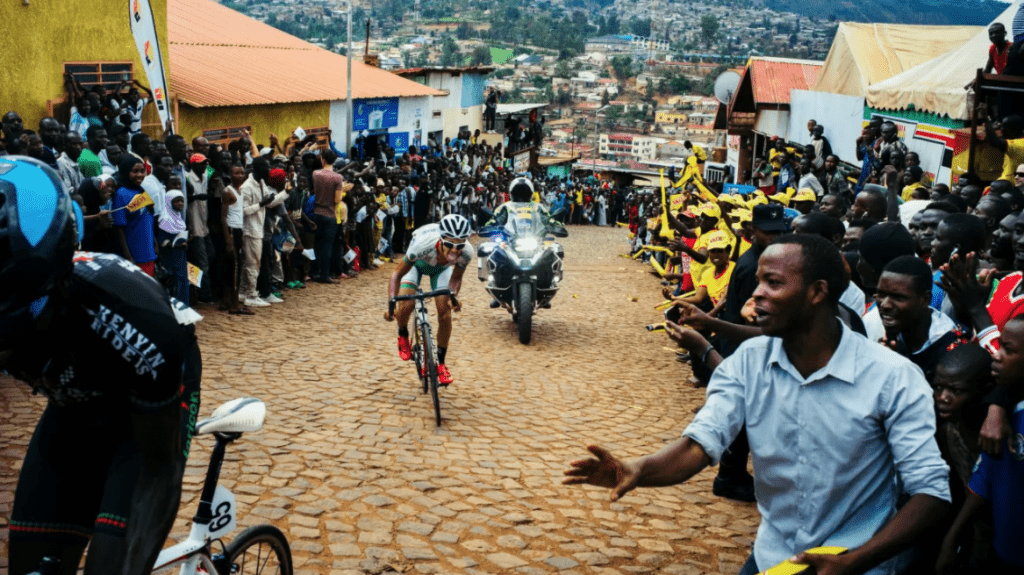 Cyclists competing as spectators cheer on