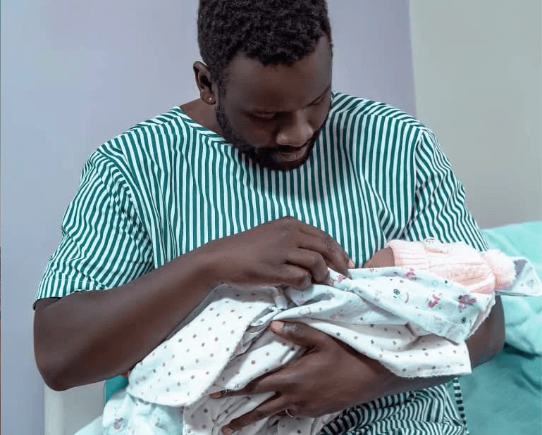 Joel Atiku Prynce with baby girl