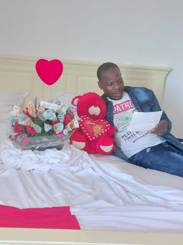 Sam Ssekajjugo with flowers from Julie Angume