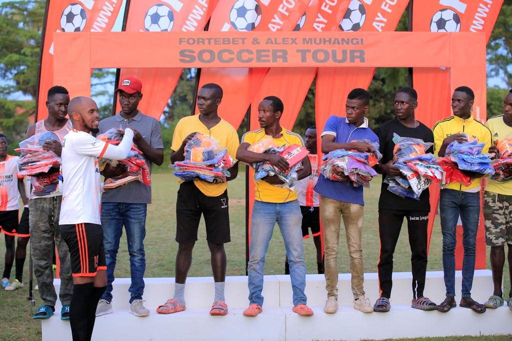Muhangi gave all the 8 participating teams jerseys and ball plus cash