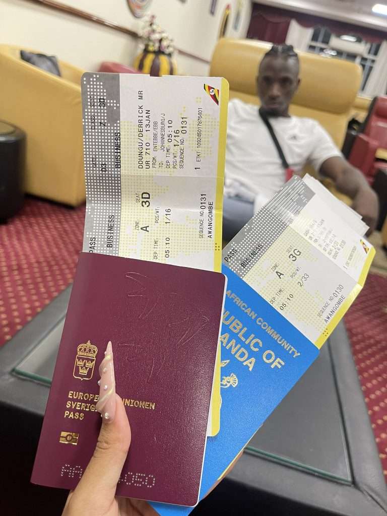 Sheilah Gashumba showing off Airtickets and Rickman waiting in the lobby