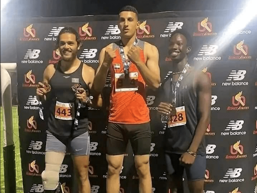 Solomon (R) on podium after winning bronze in 200m 