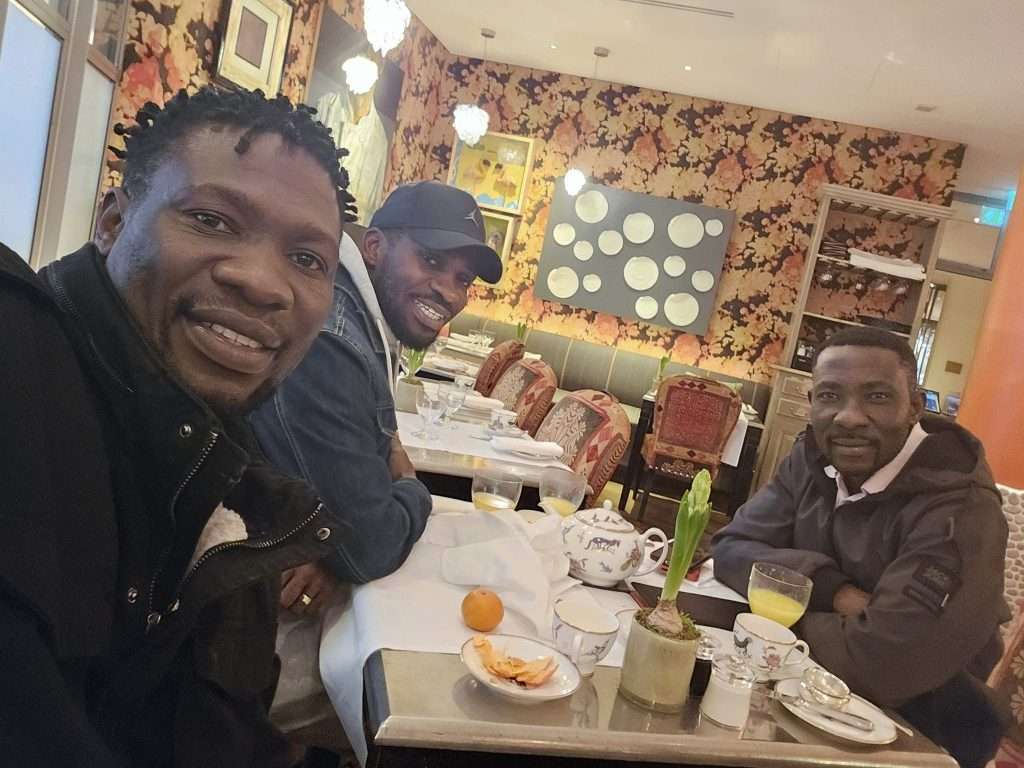 Banjo Man with Bobi Wine and a friend in the UK